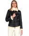 Montone shearling nero con fibbie e cerniera centrale